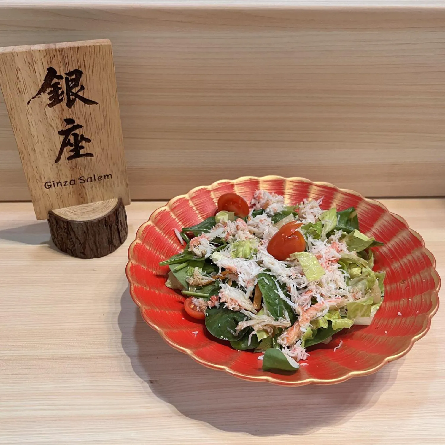 Fresh salad topped with crab meat and cherry tomatoes at Ginza Sushi and Ramen, a Japanese Restaurant in Salem