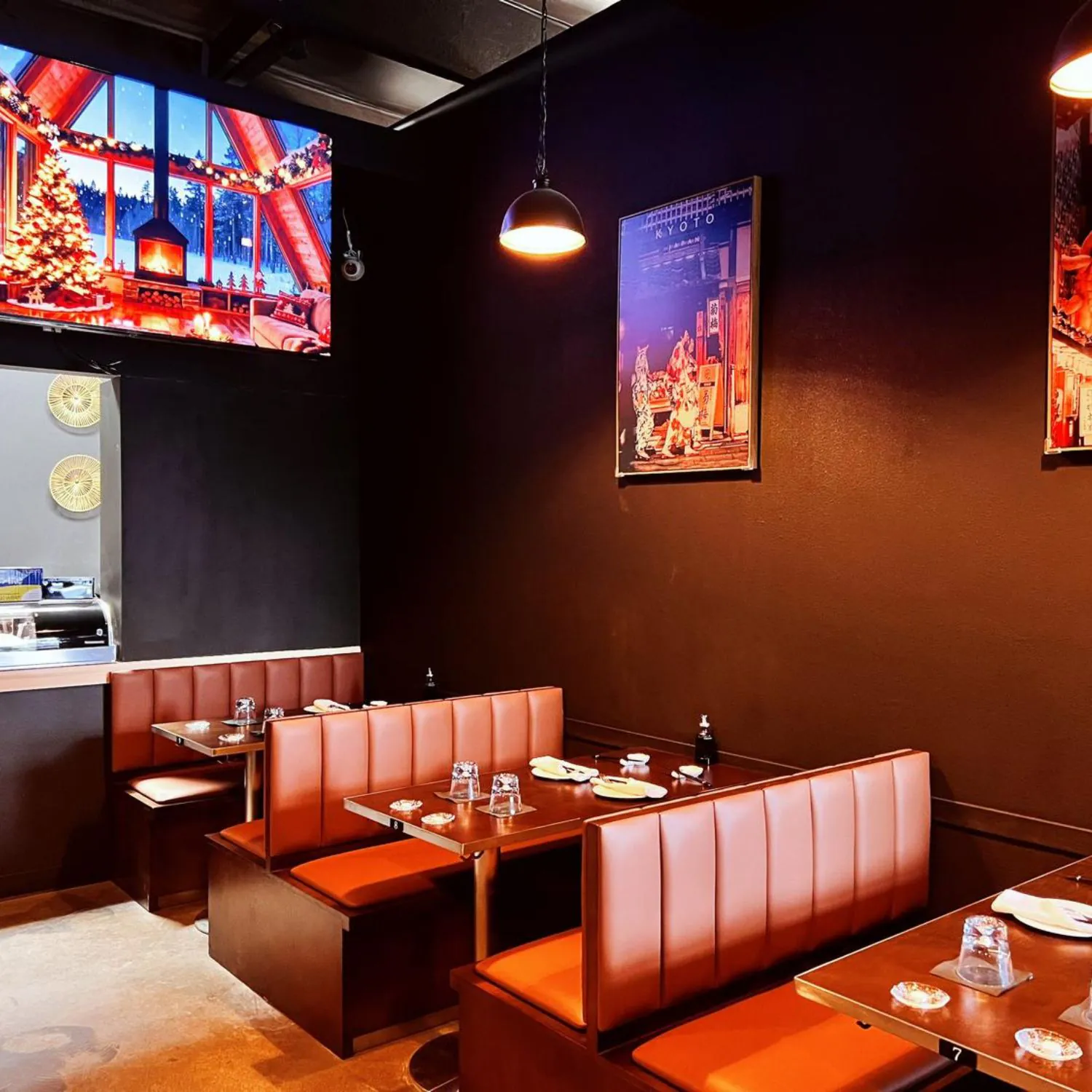 Cozy booth seating area with decorative screens and lights at Ginza Sushi and Ramen, a Japanese Restaurant in Salem