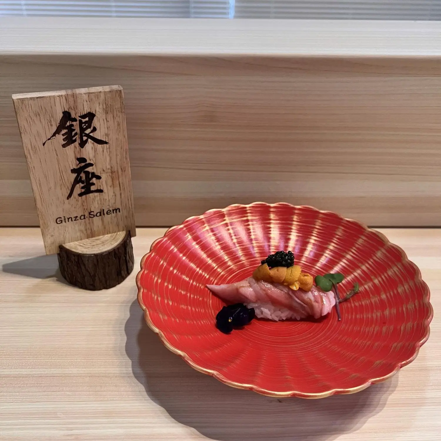 Tuna nigiri topped with caviar and garnish at Ginza Sushi and Ramen, a Japanese Restaurant in Salem